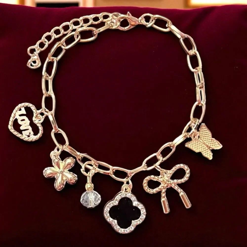 Gold Tone Charm Bracelet with Black Clover Heart Bow Butterfly And Flower Charm